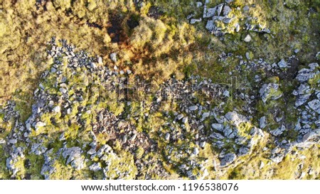 Aerial drone birds eye view of rock formations and lava fields in Iceland