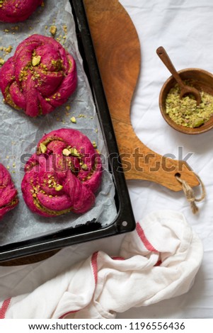 Beetroot cinnamon rolls or braided buns with pistachios