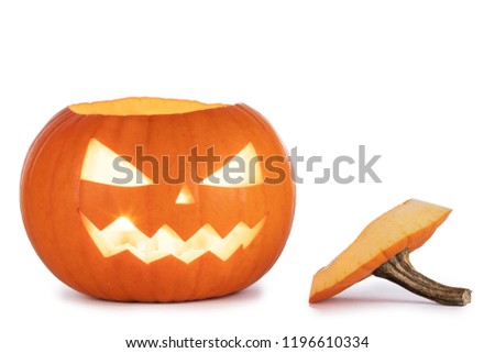 One glowing Halloween Pumpkin with peduncle away isolated on white background