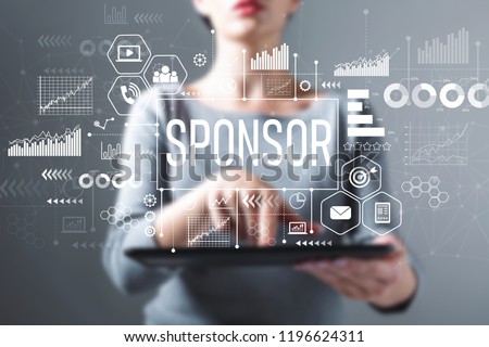 Sponsor with business woman using a tablet computer Royalty-Free Stock Photo #1196624311
