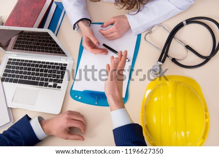 Doctor and manager agreeing industrial insurance coverage Royalty-Free Stock Photo #1196627350
