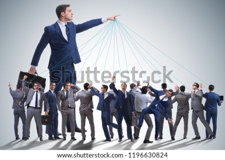 Boss employee manipulating his staff in business concept Royalty-Free Stock Photo #1196630824