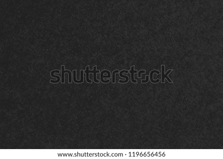 Black paper texture background.