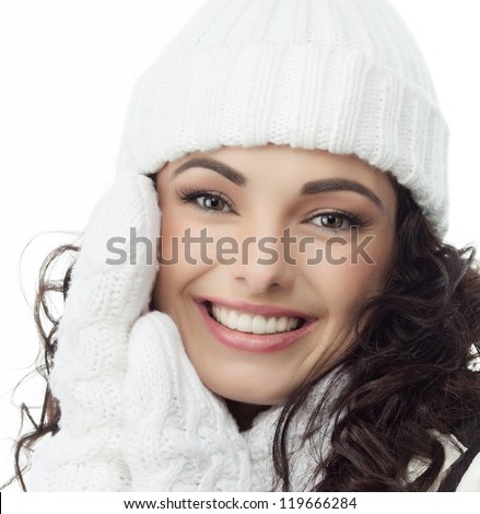 beautiful woman in warm clothing on white background