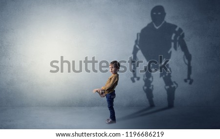 Little boy s self image appear as a big robotman shadow on his background