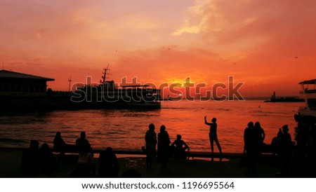 Sunset on Kadikoy Ferrdock / Istanbul/ Turkey  - People taking picture and Women Taking selfie - Silhouette 