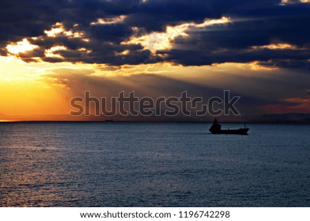 Sunset. Colorful views of the coast, cities and ports of Turkey with moored sea vessels at sunset.