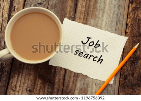 Job search inscription. Yellow office pencil and cup of coffee over rustic wooden background. Finding a job concept.