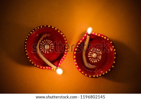 Diya- Lamps lit during the festival season of Diwali signifies the importance of light during the darkness as good over evil. .