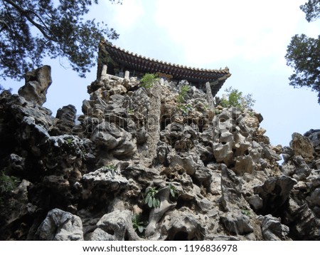 Chinese temple on a top of rocks in the Forbidden City in Beijing, China. 