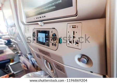 A bokeh picture of inflight entertainment equipment during a flight from Dubai to London.