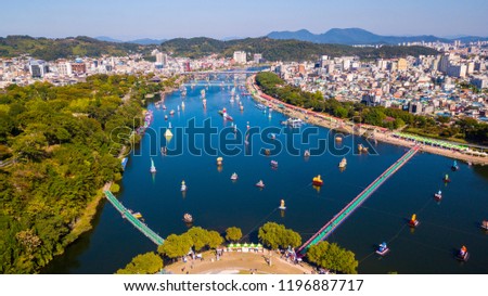 Aerial view of Jinju Namgang Yudeung Festival in Jinju city, South korea. Scenery has many lanterns are floating in the river.