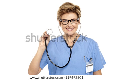 Senior female physician ready to examine you. All on white background