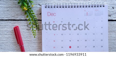 December 2018 calendar on white wooden background. Winter time and mood