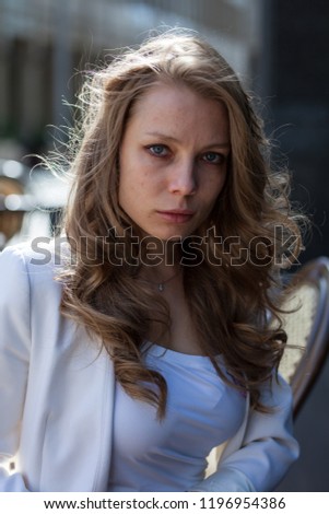 Photo session of girl was carried out on the street in the city. 