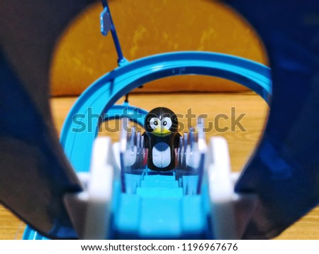 PENGUIN frisk paradise.toy penguin slides down the swirl slide and up stairs