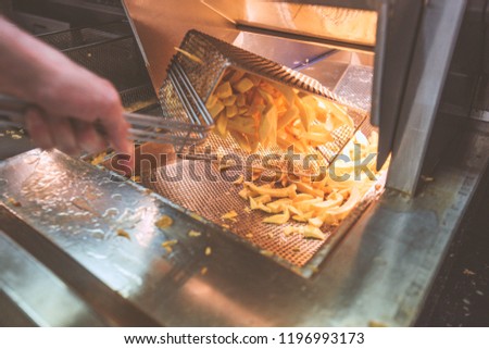 Fresh Cooked Chips  Royalty-Free Stock Photo #1196993173