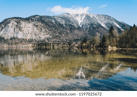 Calm lake between the mountains in Austria