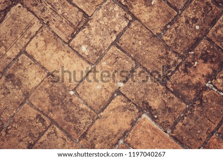 Vintage photo style of Old brick floor texture background.