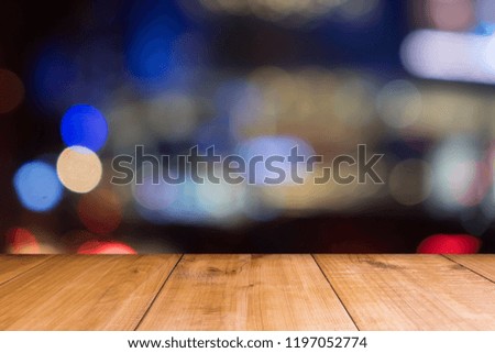 Wooden table of brown on front red brick background