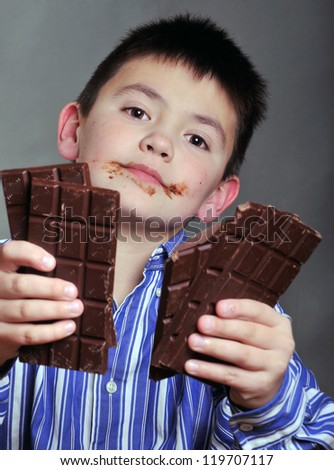 The boy with chocolate bar