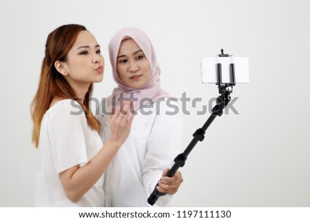 good friend selfie with selfie stick isolated on white