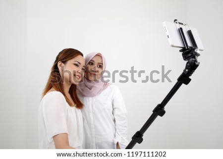 good friend selfie with selfie stick isolated on white