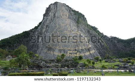 Buddha Mountain (Kao Chi Chan) is a giant sculptural image of Lord Buddha erected on the giant cliff. Translation: " 1995 Praputtamahawashira-uttamopas-sassada (year built and name of this Buddha)"