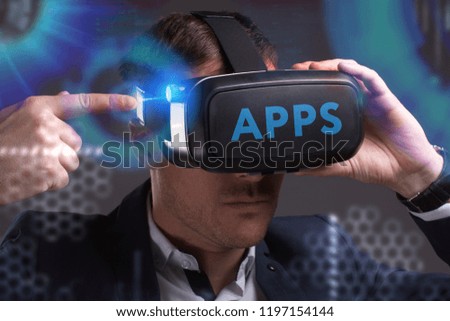Business, Technology, Internet and network concept. Young businessman working in virtual reality glasses sees the inscription: APPS