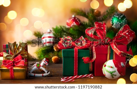 Christmas holidays composition with  gift boxes on wooden background Royalty-Free Stock Photo #1197190882