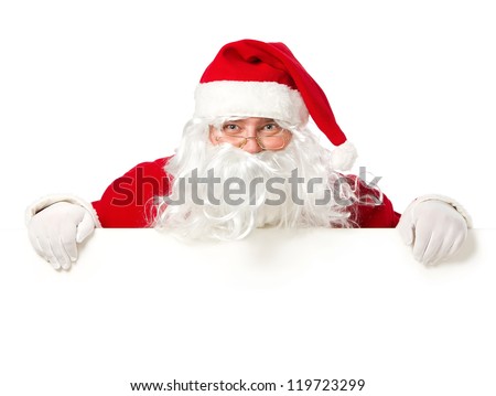 Happy Santa Claus looking out from behind the blank sign isolated on white background with copy space