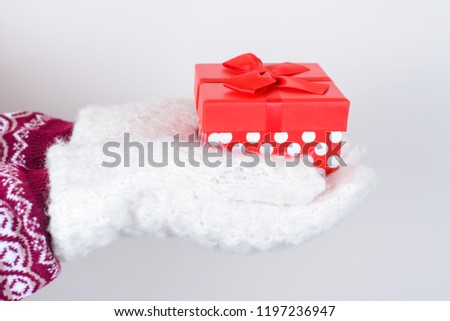 Saint valentine day love concept. Side profile cropped close up photo of cute nice trendy stylish beautiful white fluffy gloves holding box isolated on grey background copy space