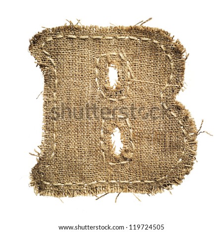 letter clipped from linen fabric