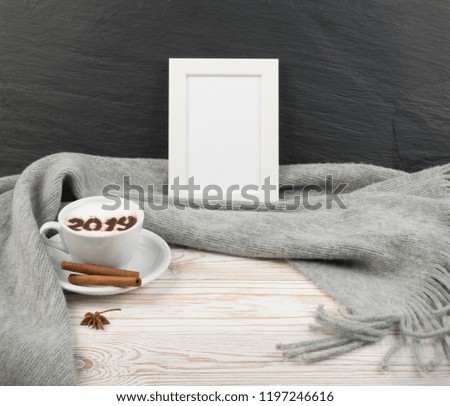 2019 Macchiato or Latte Cappuccino on Rustic Wooden Background with Grey Plaid. Hot Coffee Cup with Cream Milk Foam on Wood Table