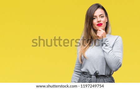 Young beautiful worker business woman over isolated background looking confident at the camera with smile with crossed arms and hand raised on chin. Thinking positive.