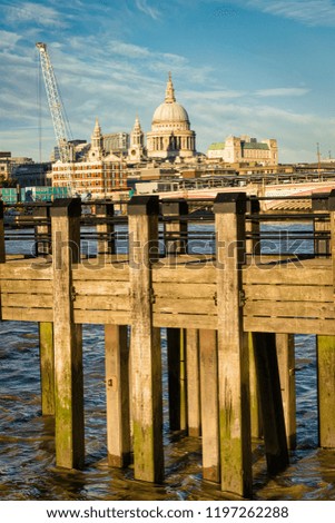 This is a picture of dock on the river Thames with St Paul's Catherdral in the backbround.