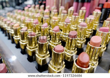 Colourful Lipstick in store or shopping Malls. Lipstick tints palette, Professional Makeup and Beauty. Beautiful Make-up concept. Lipgloss. huge assortment of women luxurious lipsticks, free shipping.