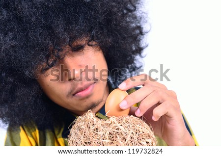 funny man take care egg in nest as Security and Safety concept
