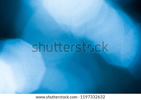 Abstract blurred background with bokeh, light and dark blue