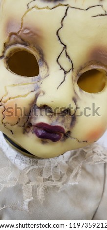 Scary cracked old doll face for halloween 