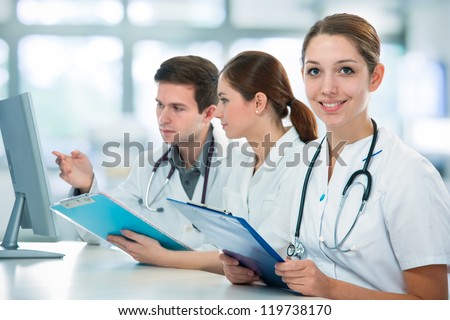 group of medical students studying in classroom