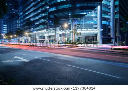 Modern building with light trails on night scene  background