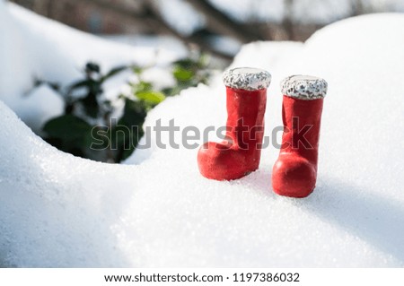 Christmas boots on snow.