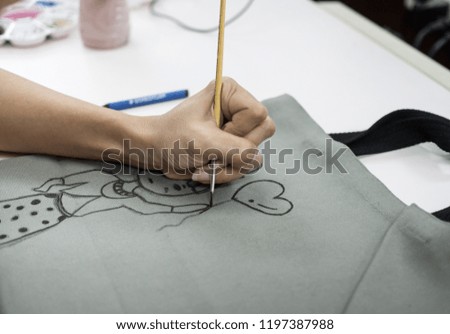 women's hand drawing on a fabric bag Royalty-Free Stock Photo #1197387988