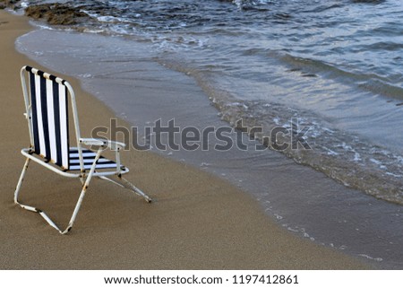chair by the mediterranean sea