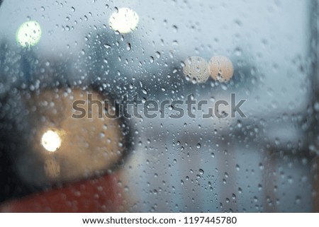 Water drops on the glass on a rainy day.