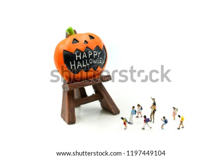 Miniature people : children with Halloween characters decorations using for concept of party halloween holiday concept.