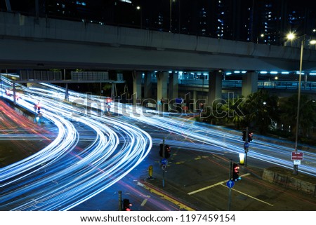 light trails of night traffic in the street in Hong Kong