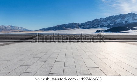 empty floor and beautiful snow mountains 