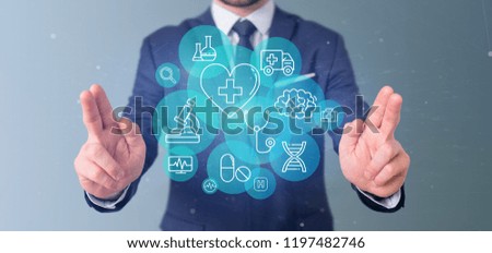 View of a Businessman holding Medical icon and connection 3d rendering